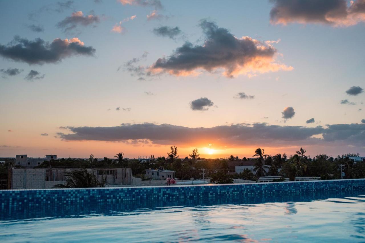 Hotel Mayari Holbox Exterior photo Sunset over Tulum